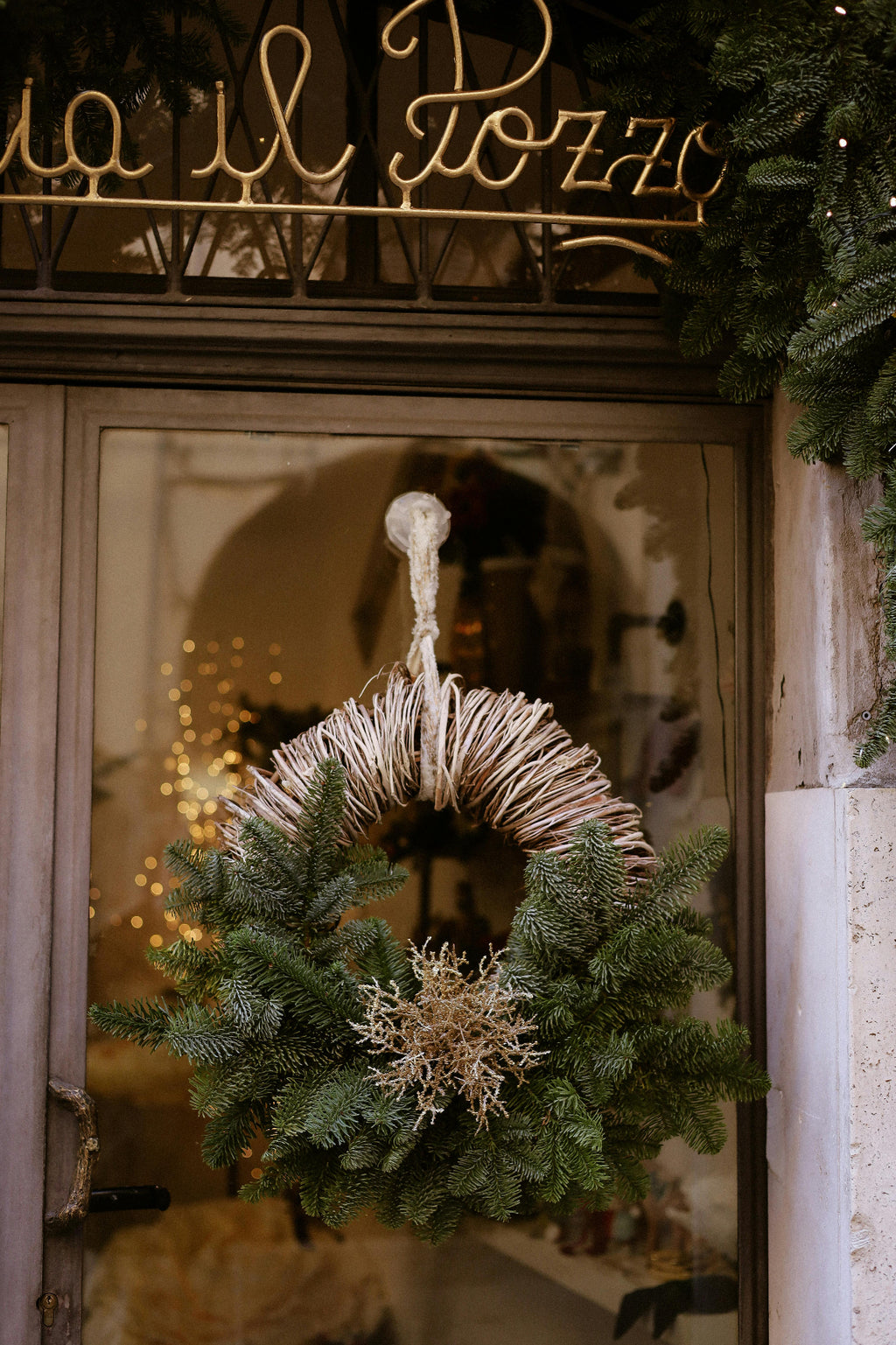 Boutique storefront Christmas wreath for an Urbandale retail shop - Front Porch Collective