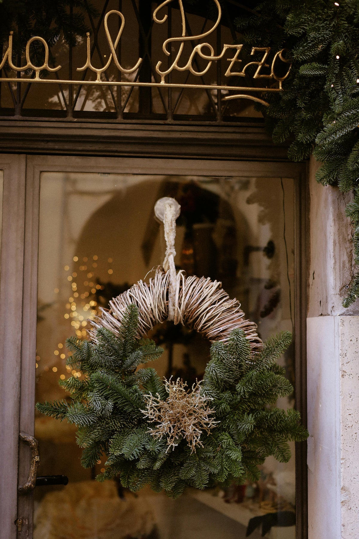 Boutique storefront Christmas wreath for an Urbandale retail shop - Front Porch Collective