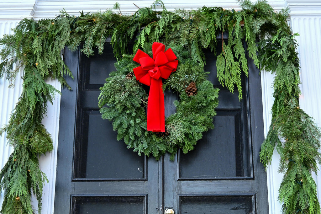 Commercial Christmas wreath installation for a Des Moines office building entrance - Front Porch Collective