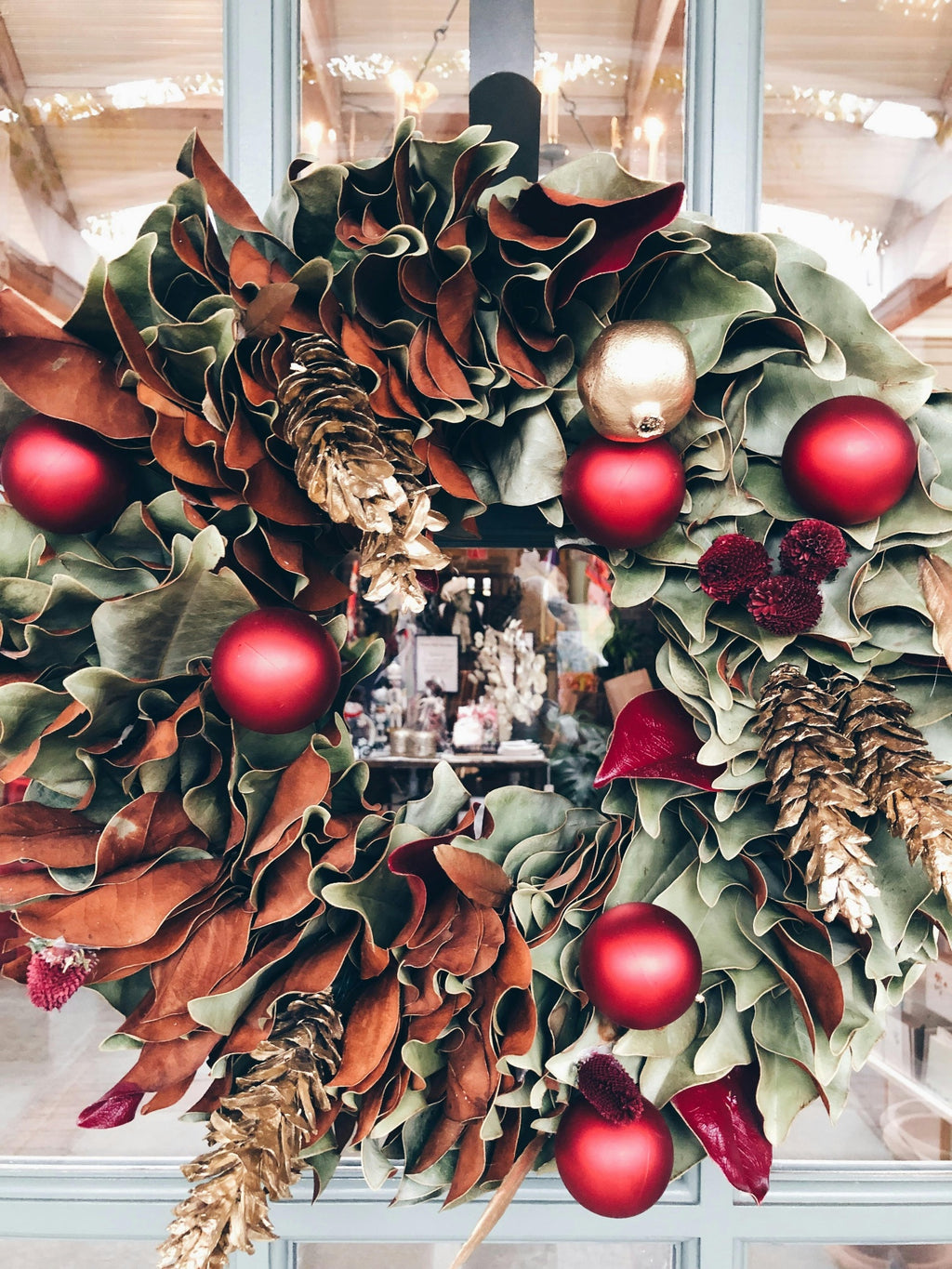 Luxury magnolia Christmas wreath for a Des Moines commercial property - Front Porch Collective